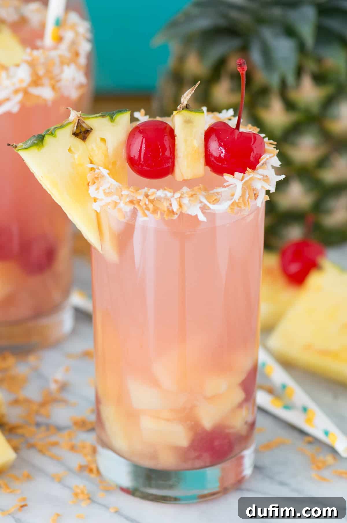 Individual serving of Pina Colada Sangria in an elegant glass, garnished with tropical flair.