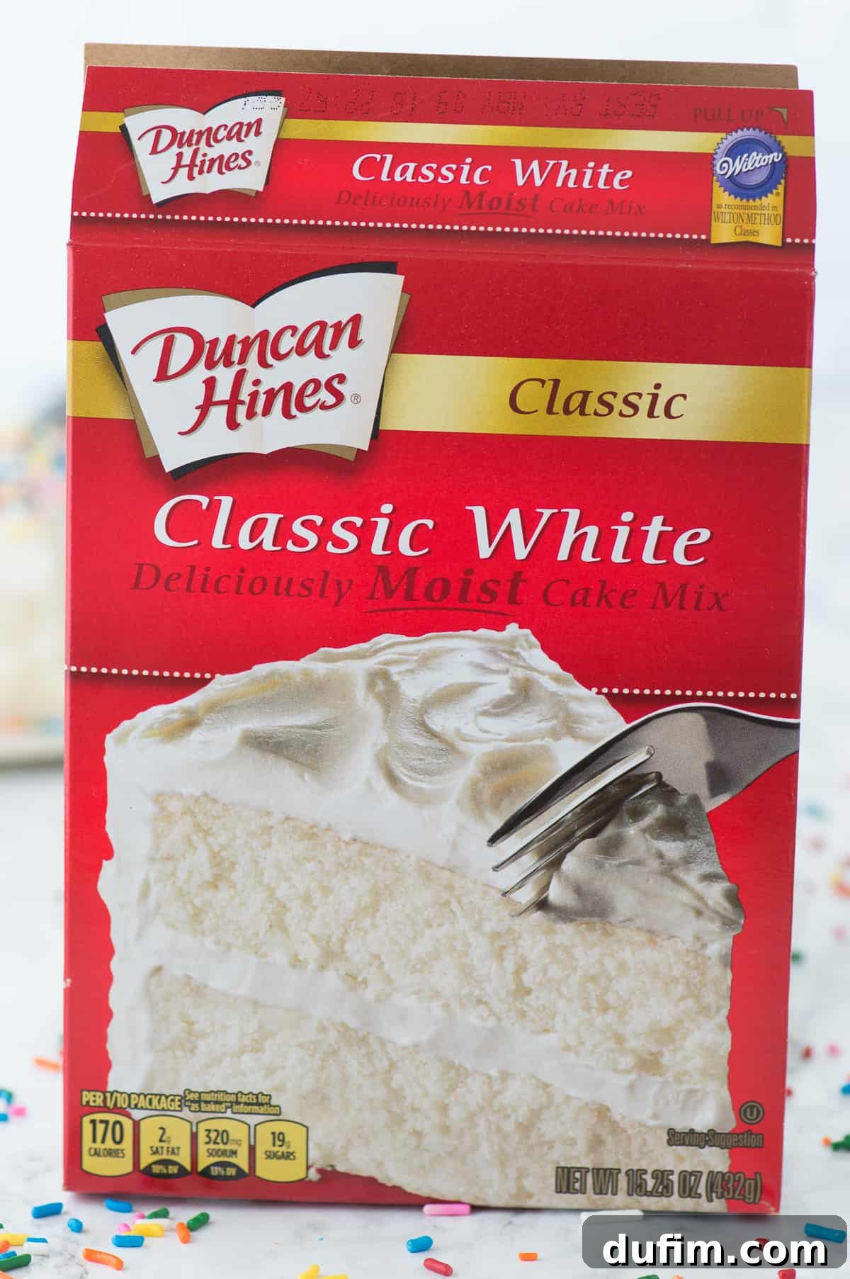 A box of Duncan Hines Classic White Cake mix, the ideal foundation for our enhanced white cake recipe.