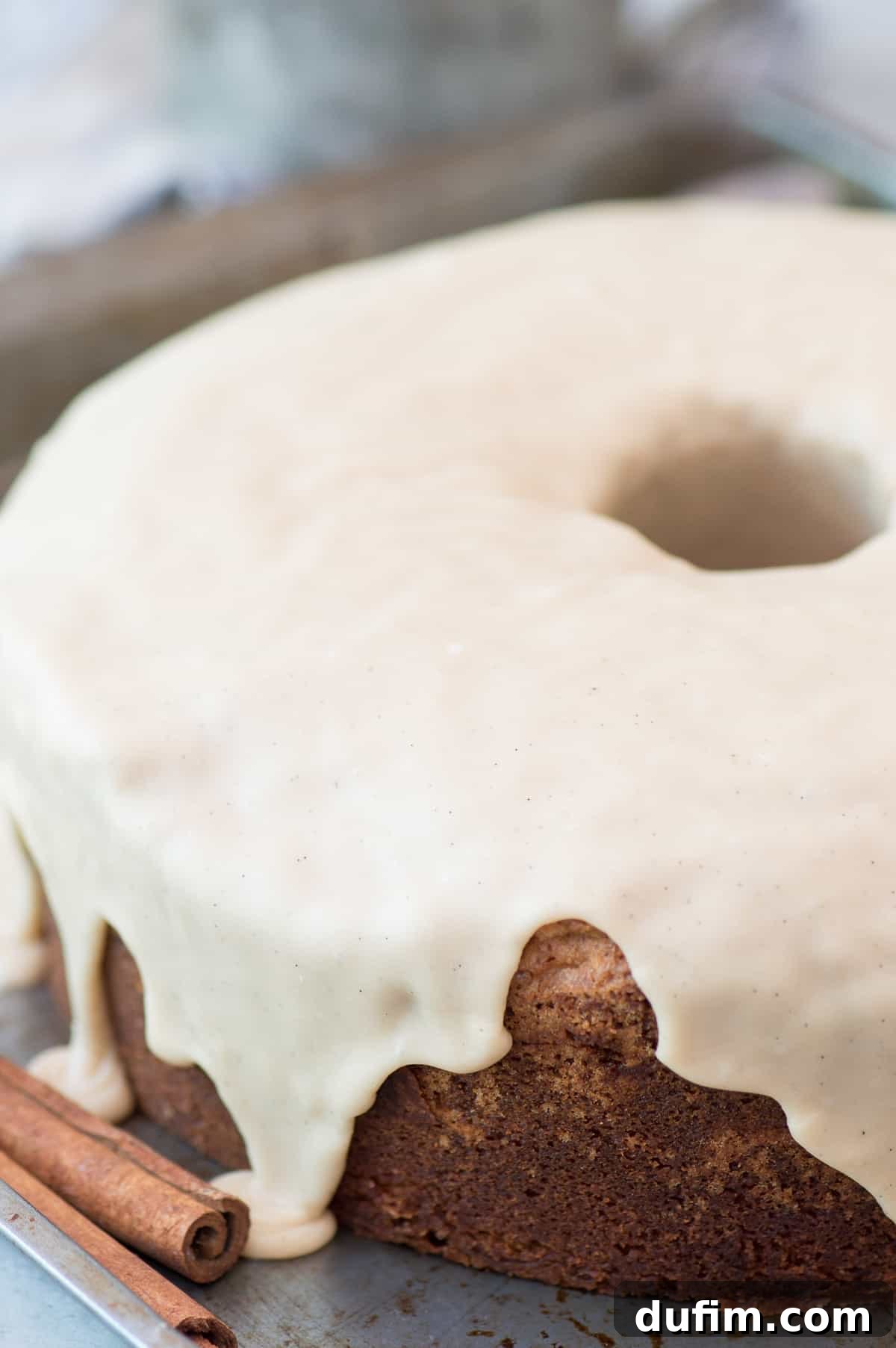 Close-up of the rich, golden-brown crust of a brown sugar pound cake, highlighting its comforting texture and inviting aroma. Perfect for fall baking.