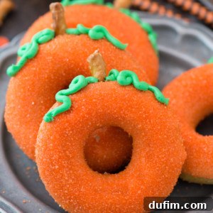 Simple, baked pumpkin spice donuts that taste and LOOK like pumpkins! These donuts that look like pumpkins add a lot of fall flare!