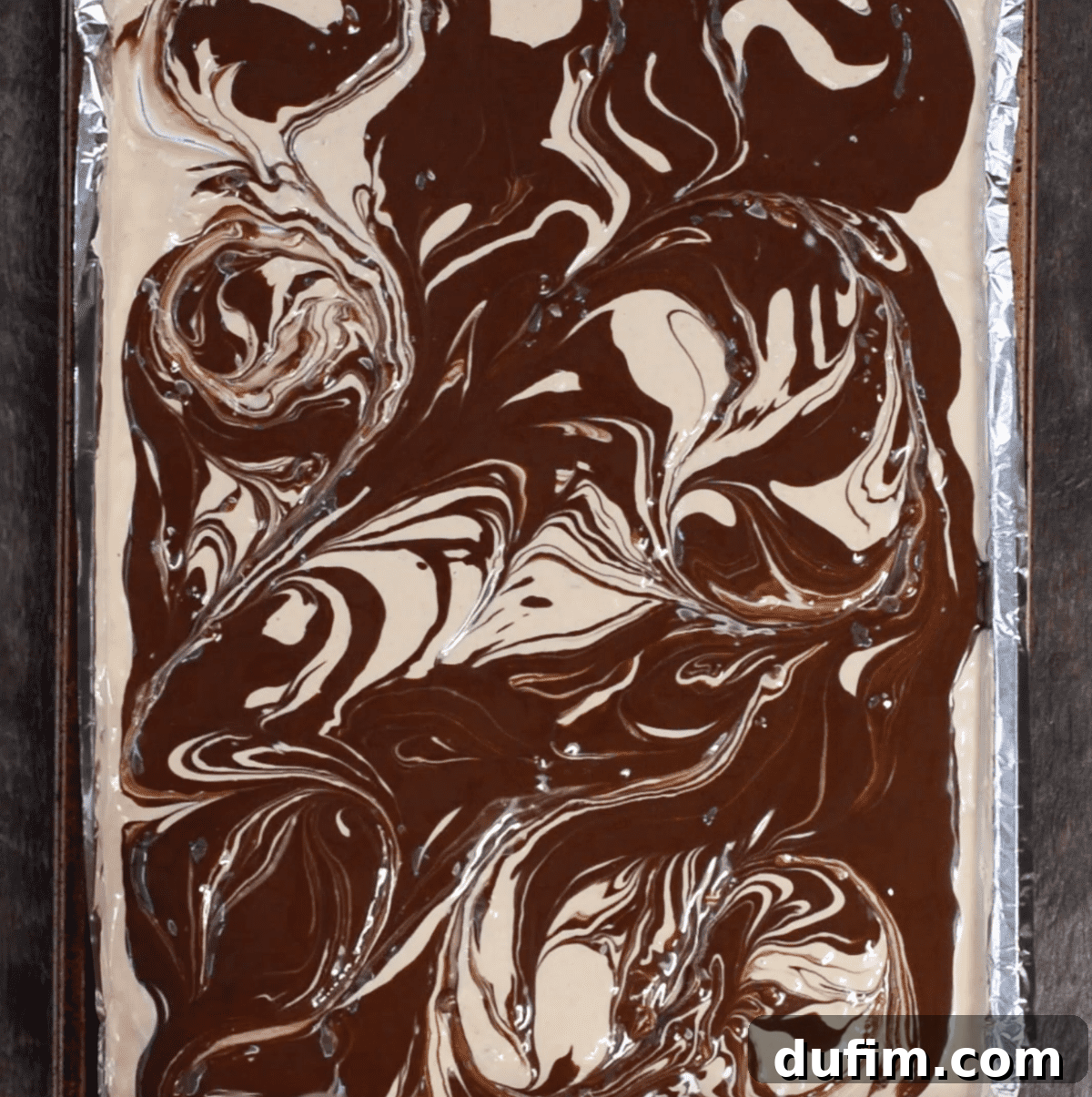 The finished swirling process, showing distinct and beautiful chocolate and peanut butter marbled patterns.