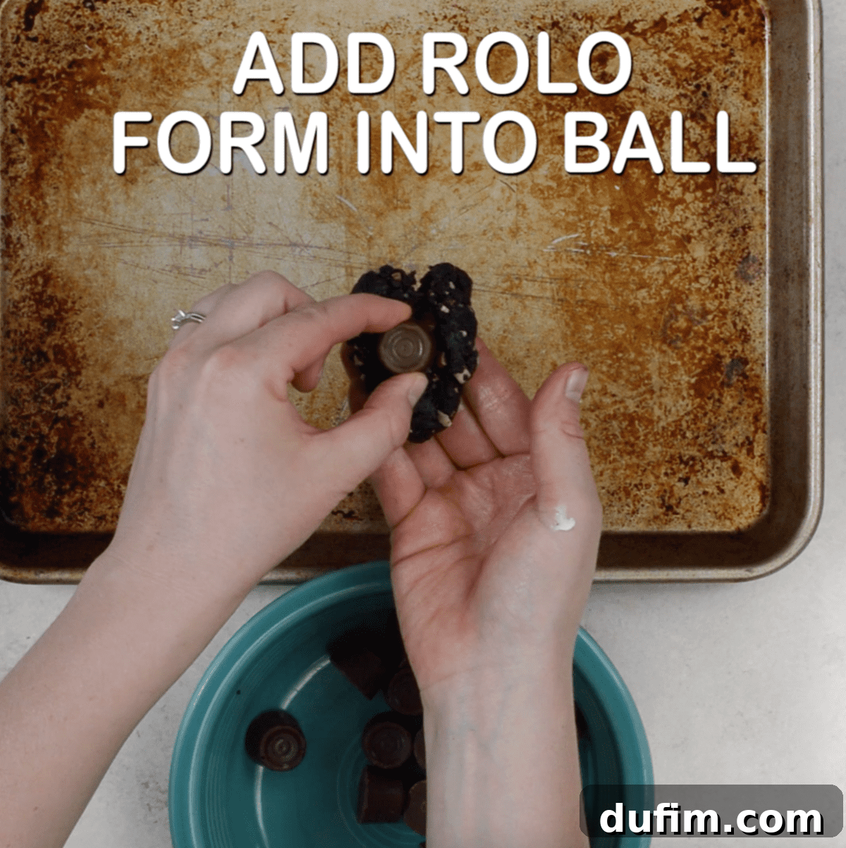 Decadent Turtle Oreo Truffles 8 Hands rolling an Oreo ball that has been stuffed with a Rolo candy