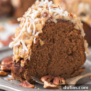 A delectable slice of German chocolate bundt cake, crowned with a rich coconut-pecan frosting and a sprinkling of shredded coconut, elegantly presented on a plate alongside pecan pieces and a fork, inviting you to indulge.