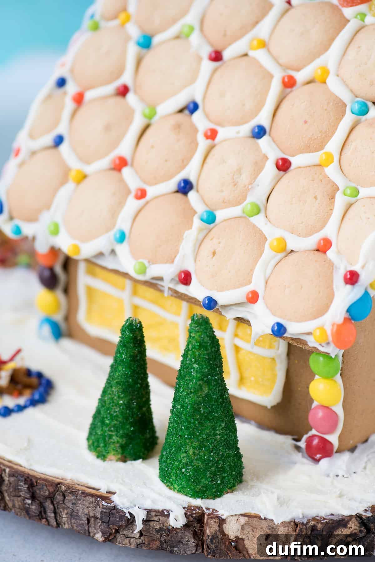 A close-up shot of a gingerbread house structure, highlighting the sturdy base and readiness for decorating.