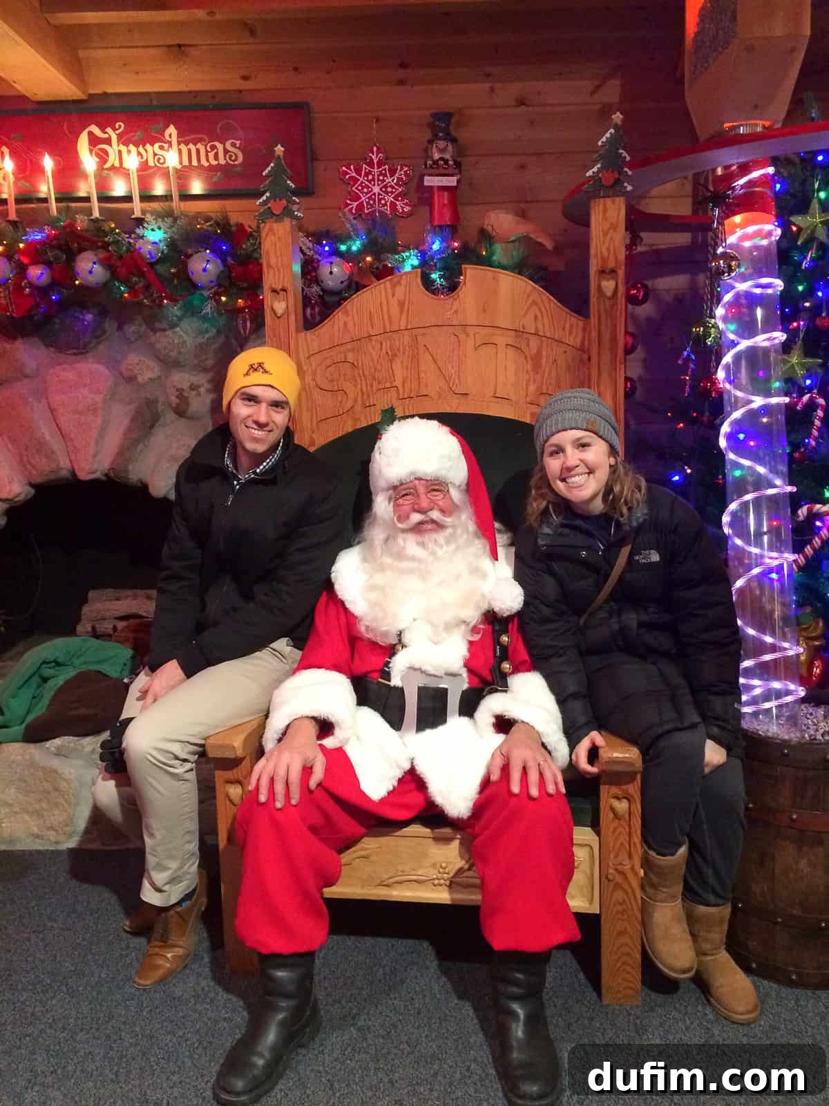 November's Gastronomic Adventures 13 A couple posing with Santa Claus, with Santa's impressive white beard.