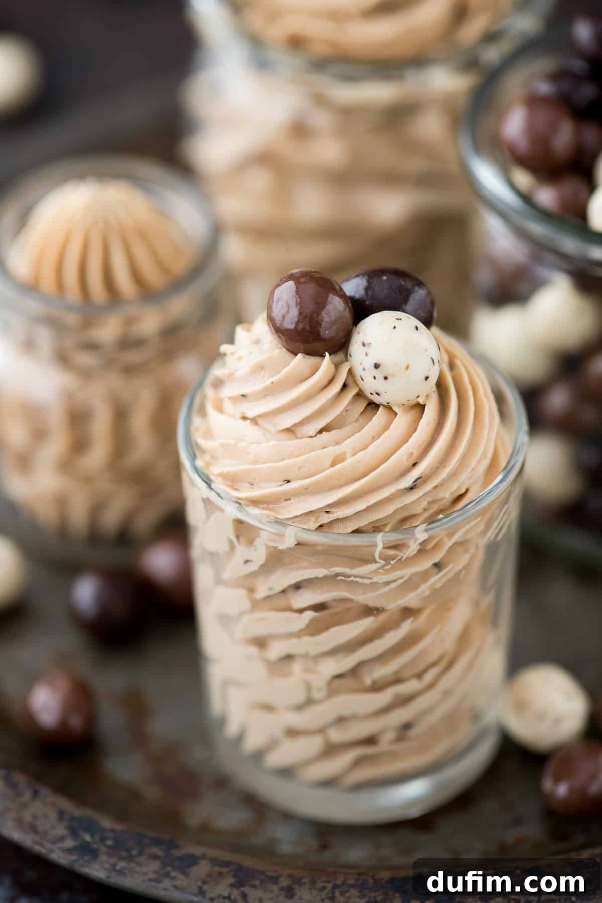 Decadent Coffee Frosting 3 A close-up of the finished coffee frosting, showing its creamy texture and the subtle flecks of instant coffee granules that add to its appeal, ready to be spread or piped.