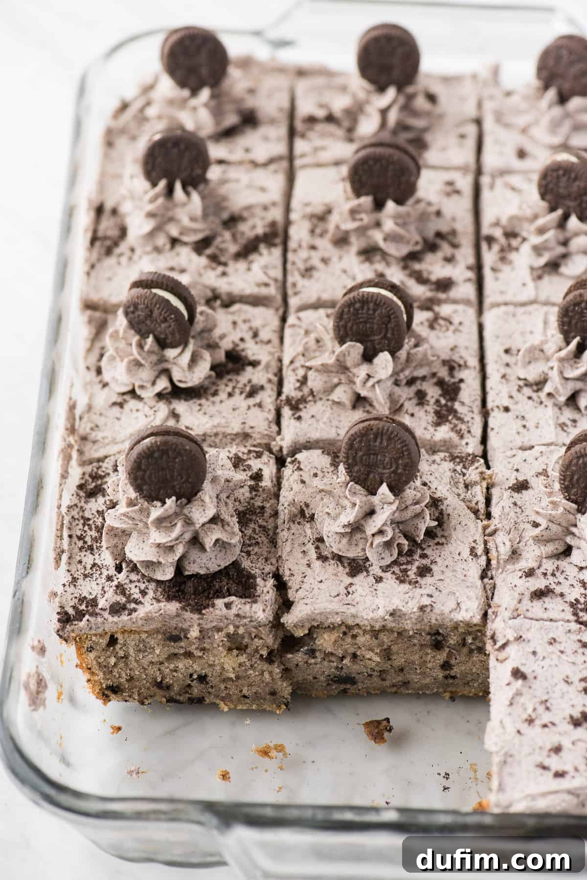 Oreo cake cut into pieces in glass 9x13 inch pan