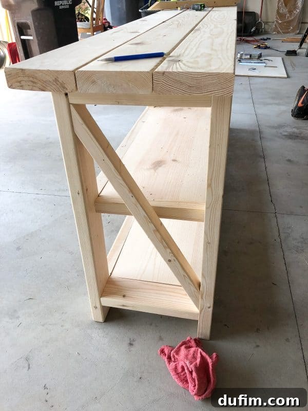 Assembling the decorative X-braces on the side of the rustic console table
