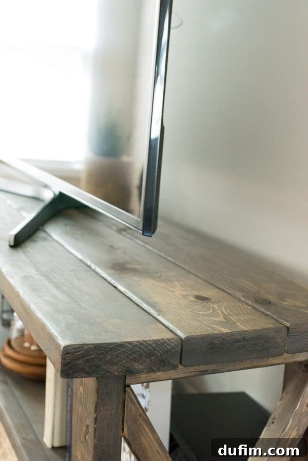 Another perspective of the finished rustic farmhouse console table in a stylish living room