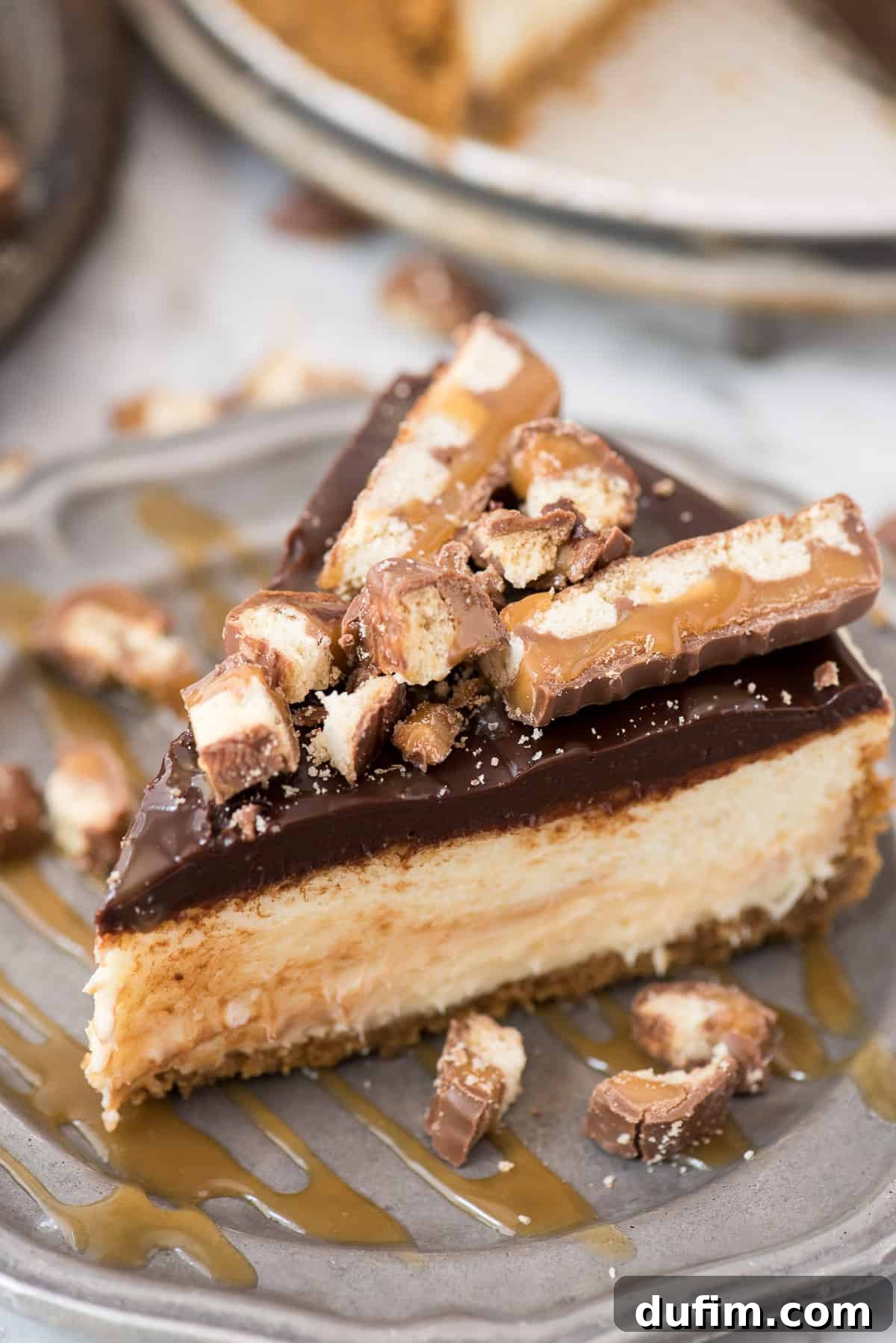 Caramel swirled into the creamy cheesecake batter, promising a burst of sweet flavor with every bite. A creamy cheesecake batter swirled with rich caramel sauce in a springform pan, ready for baking.