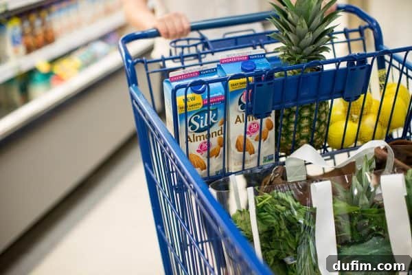 woman with shopping cart in a grocery store, showing effective product placement for brand photos