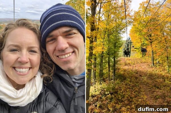 Chair lift ascending a ski mountain covered in vibrant fall foliage in Northern Michigan
