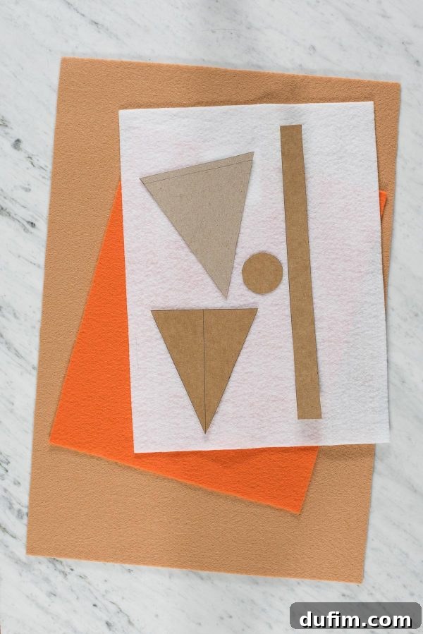 Handmade Thanksgiving Pumpkin Pie Garland: Step-by-Step Craft Festive felt pumpkin pie garland draped decoratively, featuring multiple pie segments with tan crusts and orange filling.
