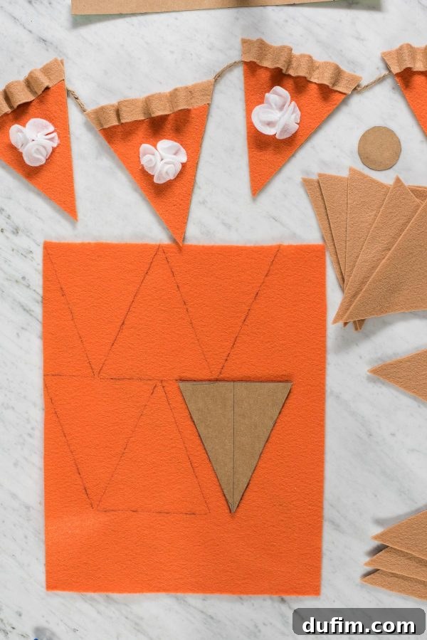 Tracing Orange Felt for Pumpkin Pie Filling Tracing the orange felt pie filling template onto a large orange felt sheet for the garland creation.