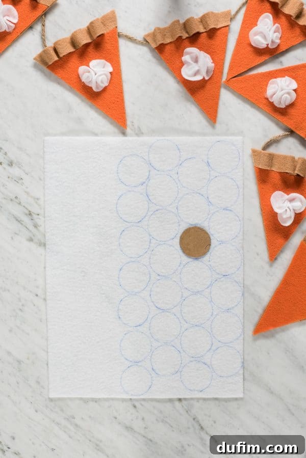 Felt Whipped Cream Circles for Pie Garland Tracing white felt circles for the whipped cream topping of the pumpkin pie garland.