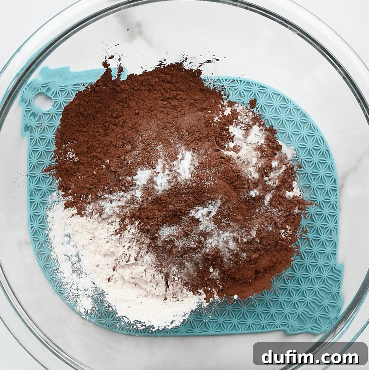 dry ingredients to make cookies in a glass bowl 