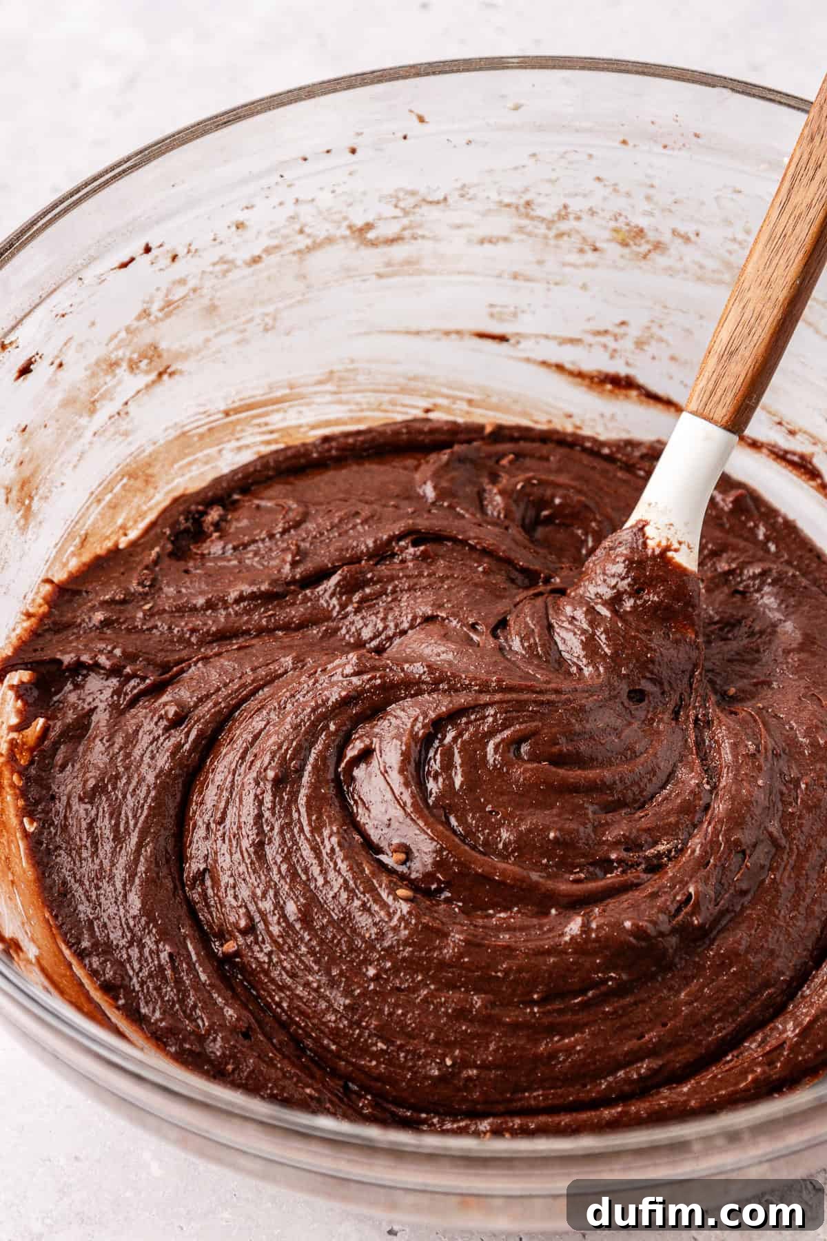 Decadent Chocolate Brownies 15 Close-up of the fully combined brownie batter, smooth and rich, with no visible streaks of dry ingredients, ready for baking.