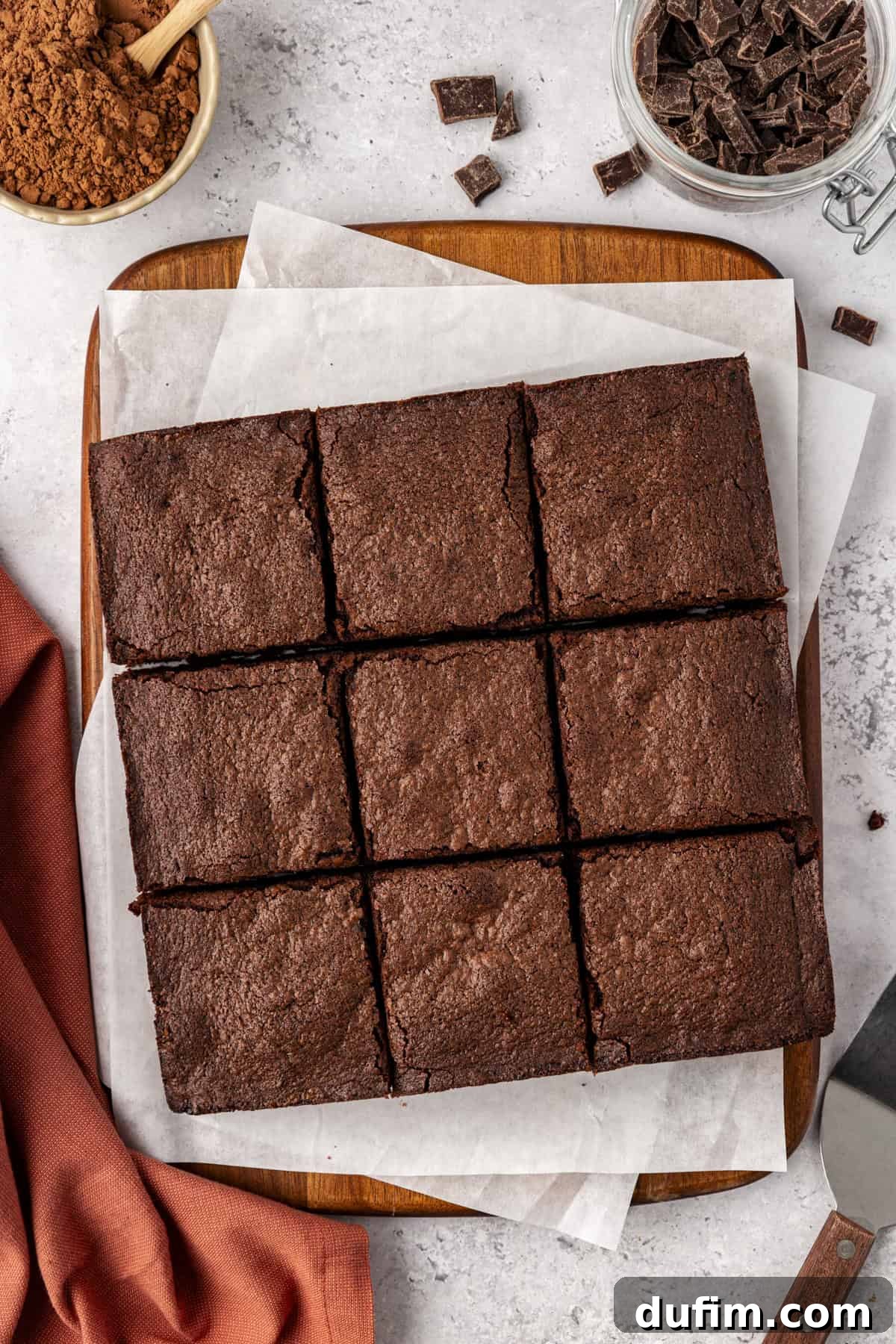 Decadent Chocolate Brownies 5 A freshly baked pan of classic homemade brownies, cut into nine perfect squares, showcasing their rich, dark color and inviting texture.