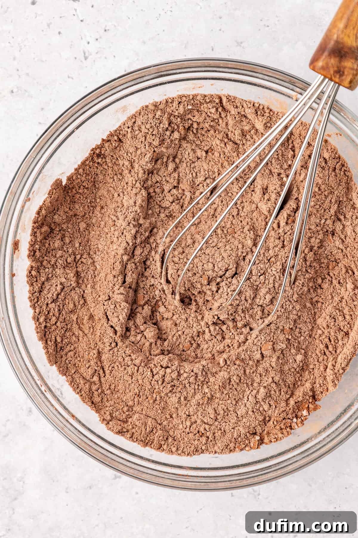 Decadent Chocolate Brownies 7 Close-up of the perfectly whisked dry ingredients for brownies, showing a uniform blend of flour, salt, and cocoa powder.