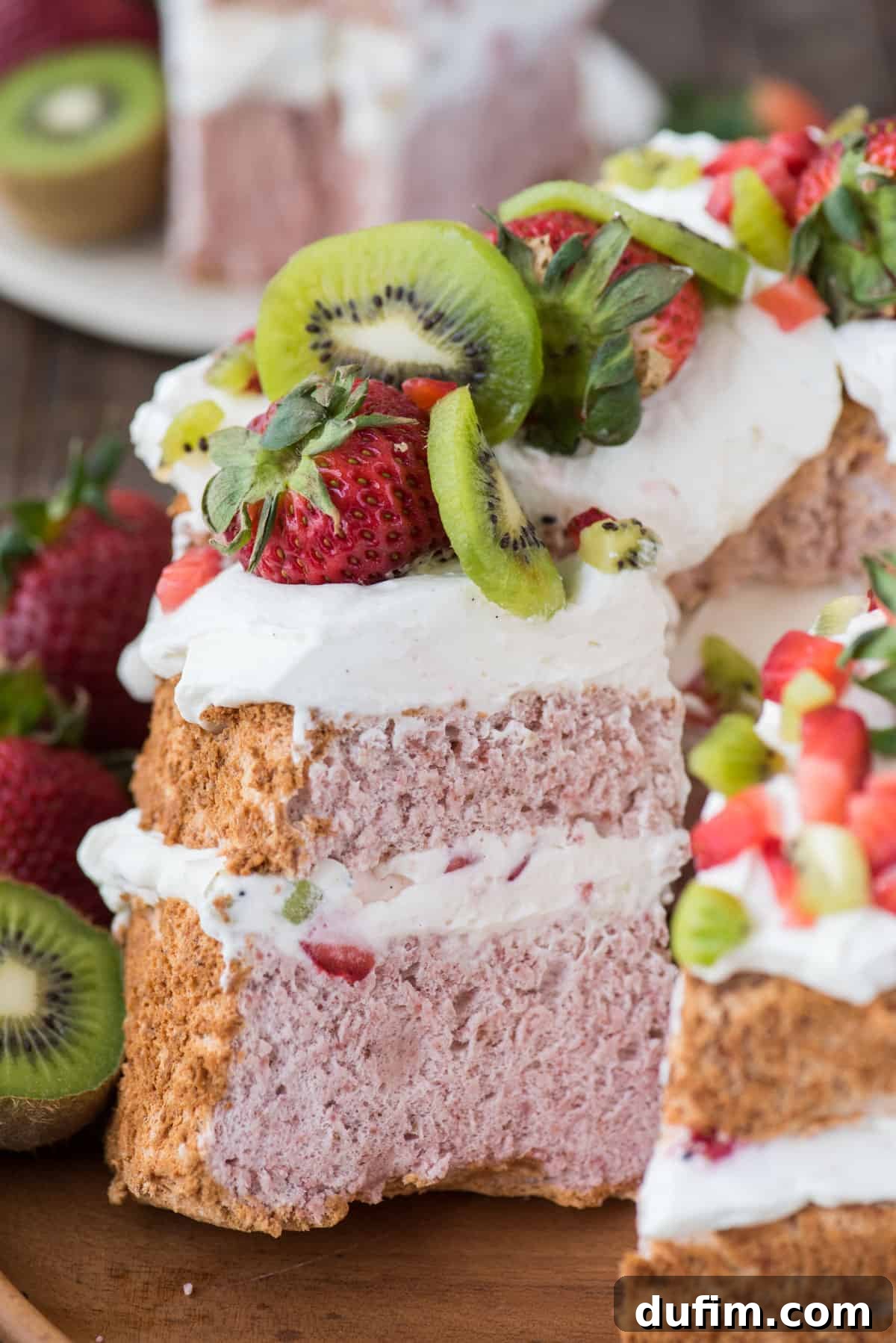Heavenly Strawberry Cloud Cake 4 slice of strawberry angel for cake with whipped cream, strawberries and kiwi