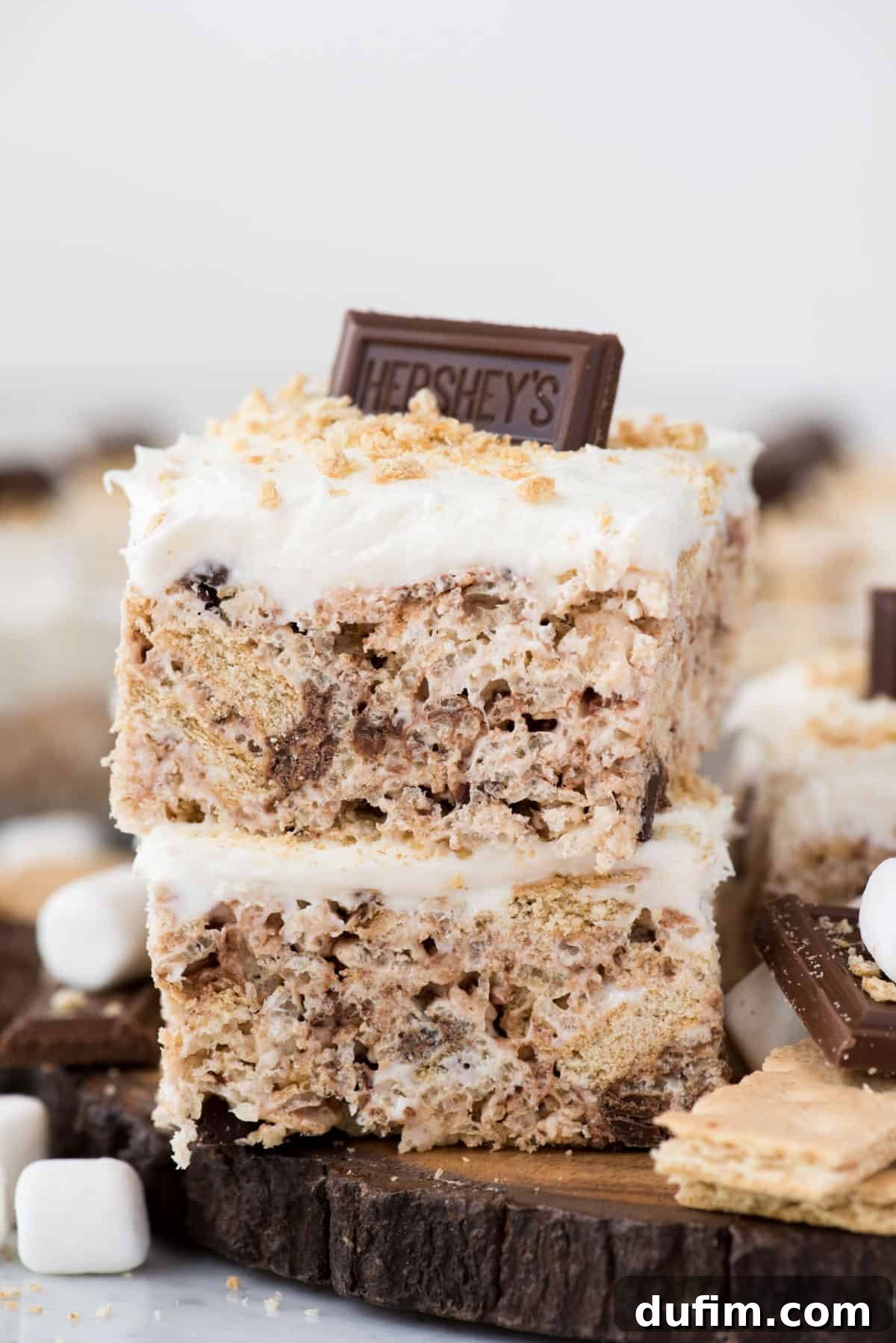 No-Bake S'mores Rice Krispie Treats 5 Two S'mores Rice Krispie treats, cut into perfect squares and elegantly stacked, ready to be enjoyed.