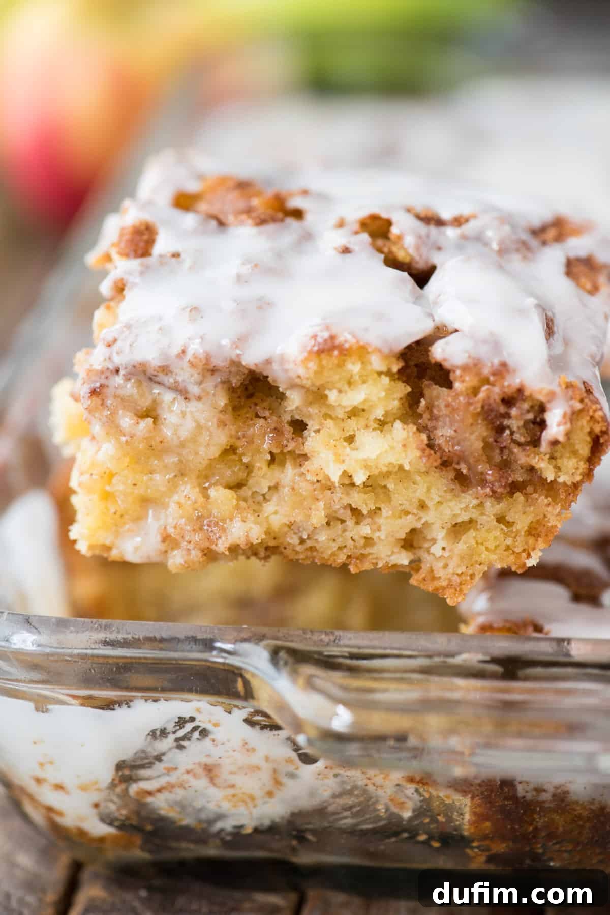 Effortless Apple Spice Coffee Cake 2 Irresistible apple coffee cake with sweet white icing, baked to perfection in a glass 9x13 inch pan, ready to be served for breakfast or dessert.