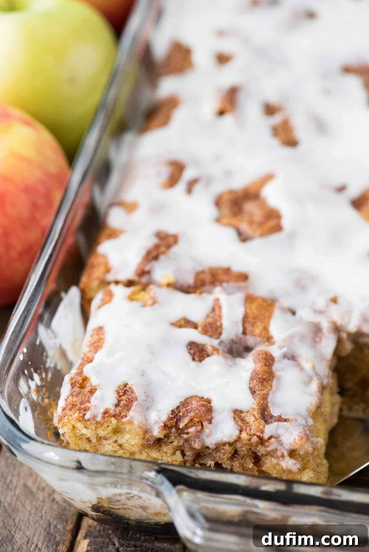 Effortless Apple Spice Coffee Cake 13 A perfectly baked apple coffee cake with a rich white icing, presented beautifully in a glass 9x13 inch pan.