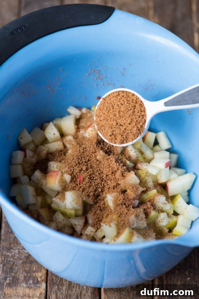Effortless Apple Spice Coffee Cake 5 A small bowl containing a mixture of brown sugar and cinnamon, prepared for the apple coffee cake swirl.