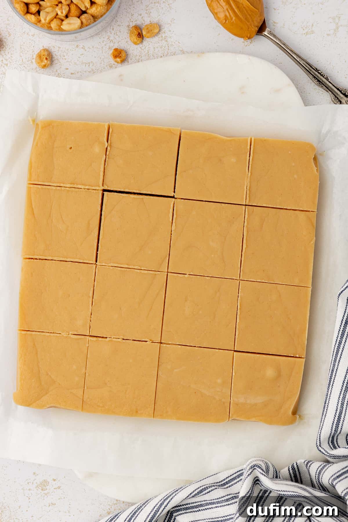 Neatly cut squares of microwave peanut butter fudge ready to be served