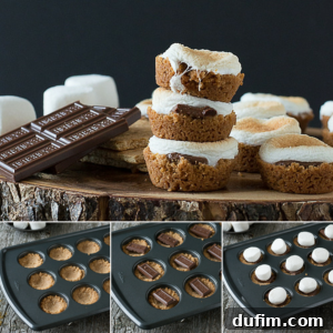 S’mores cookie cups stacked on a wood board, topped with toasted marshmallows and chocolate bars. This image captures the delicious outcome of the mini s'mores made in a muffin tin.