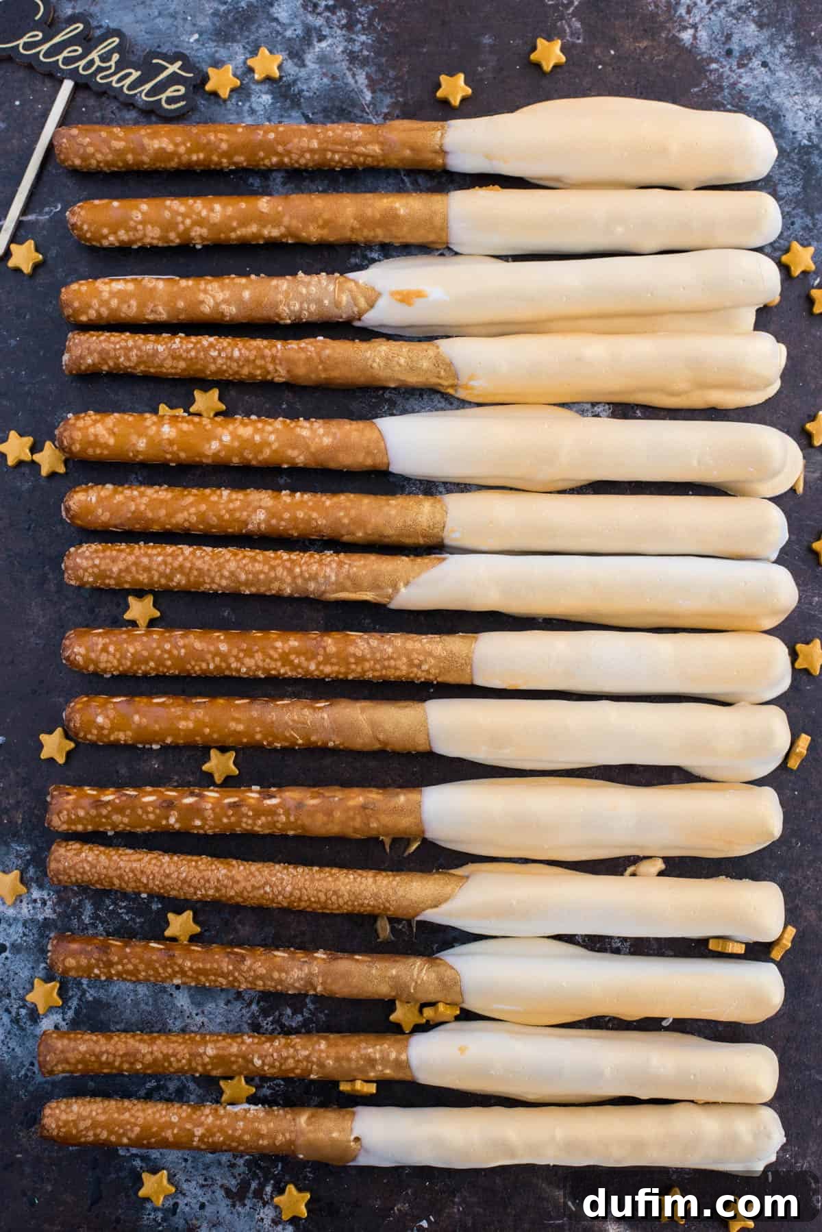 Striking New Year's Eve gold pretzels on a dark background, showcasing their shimmering finish and festive appeal.