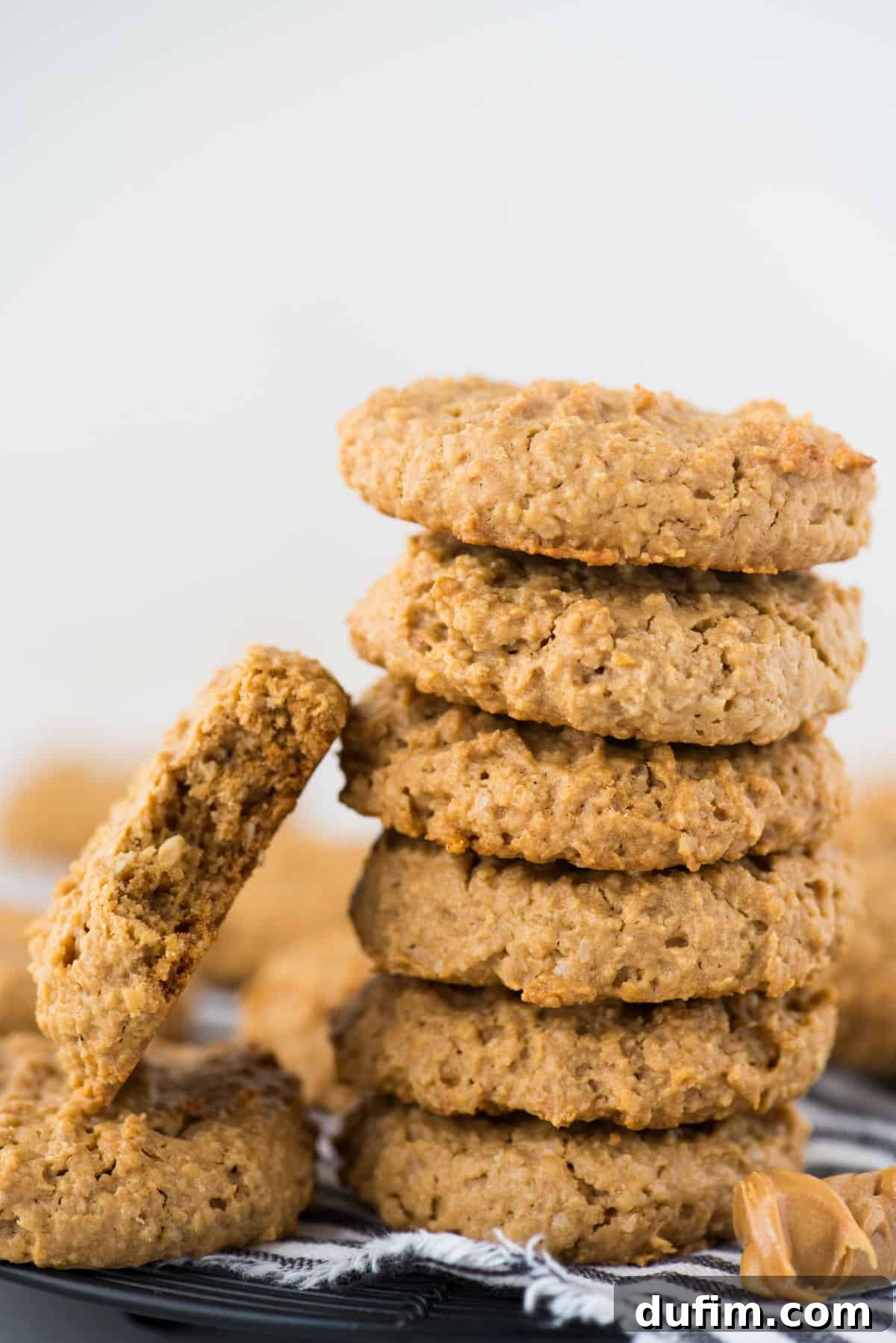 Guilt-Free Peanut Butter Oatmeal Treats 5 A beautifully arranged stack of healthy peanut butter oatmeal cookies on a crisp white surface.