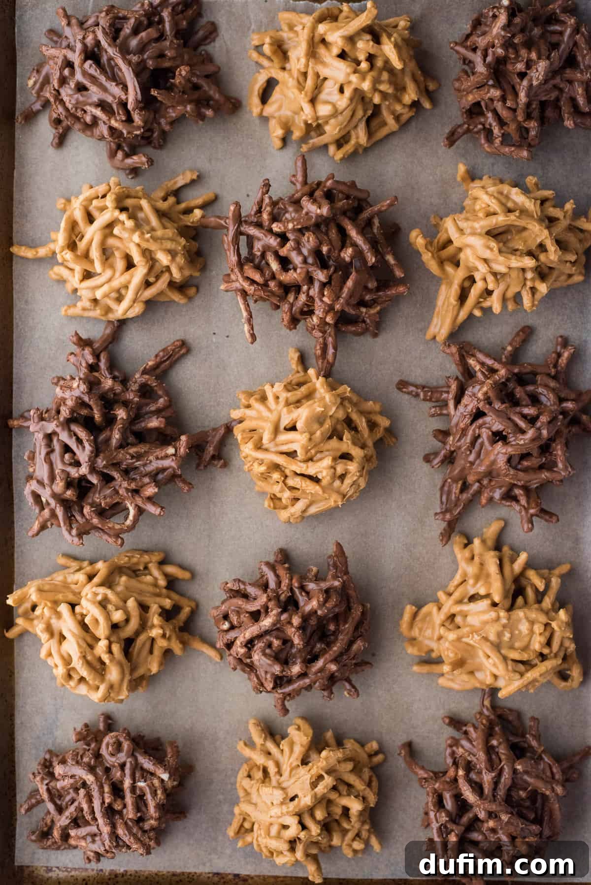 butterscotch haystack cookies and chocolate haystack cookies arranged on brown parchment paper