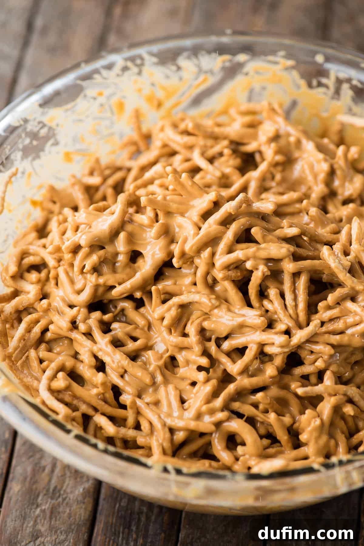 peanut butter haystack mixture in glass bowl
