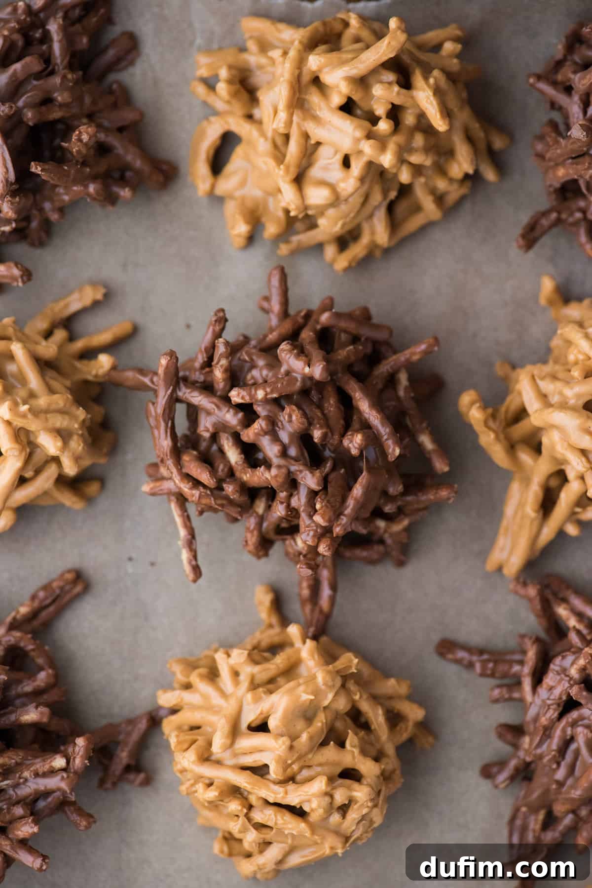 butterscotch haystack cookies and chocolate haystack cookies arranged on brown parchment paper