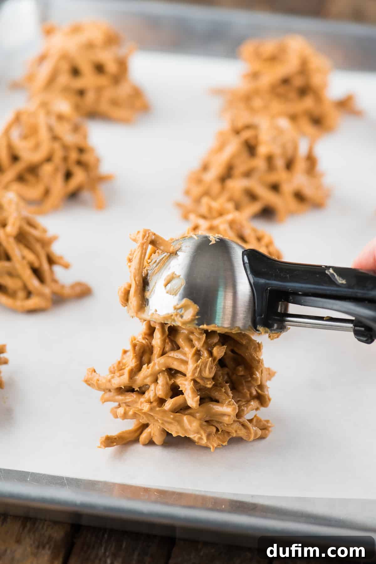 butterscotch haystack cookies on white parchment paper