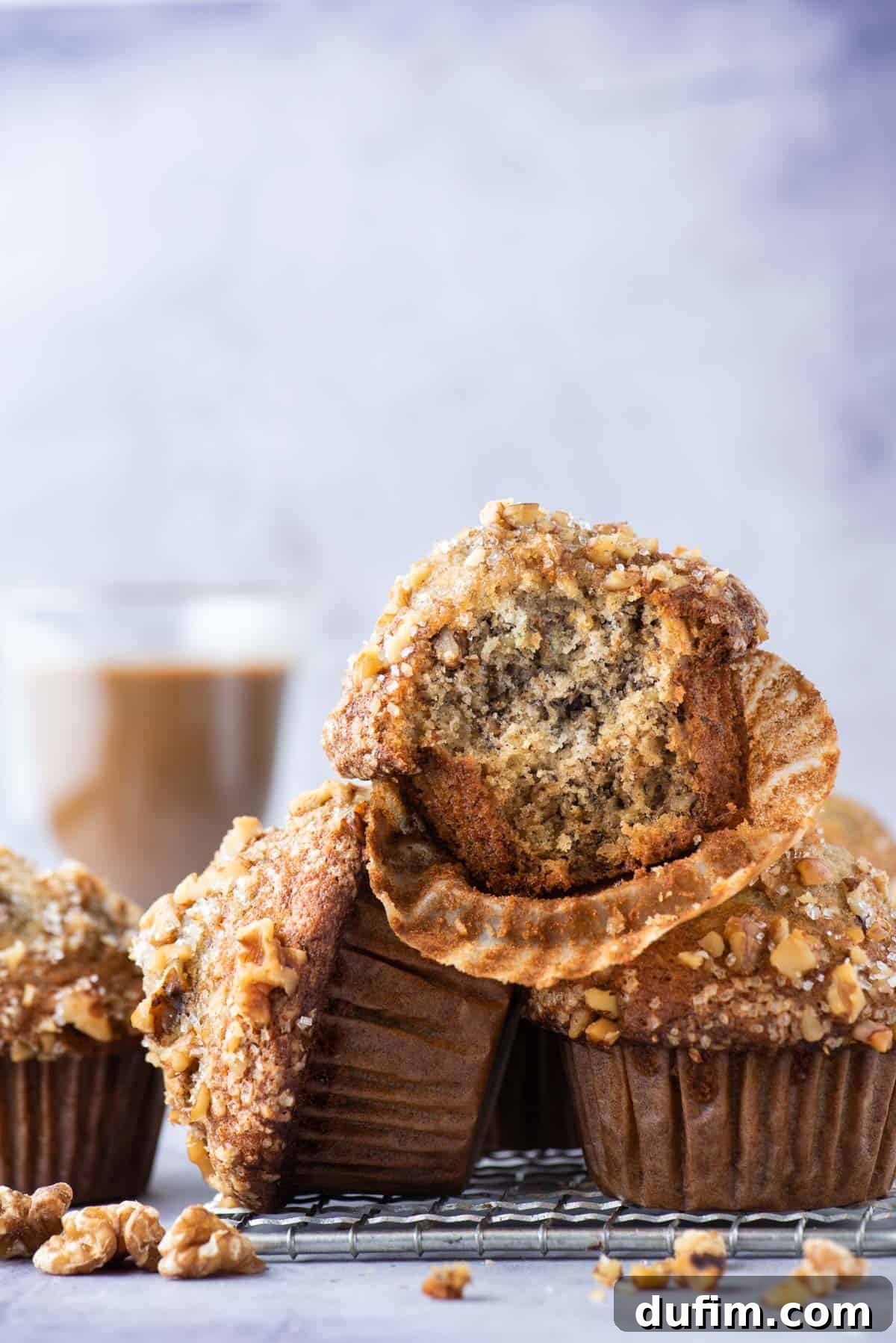 banana nut muffins stacked in a pile on wire rack