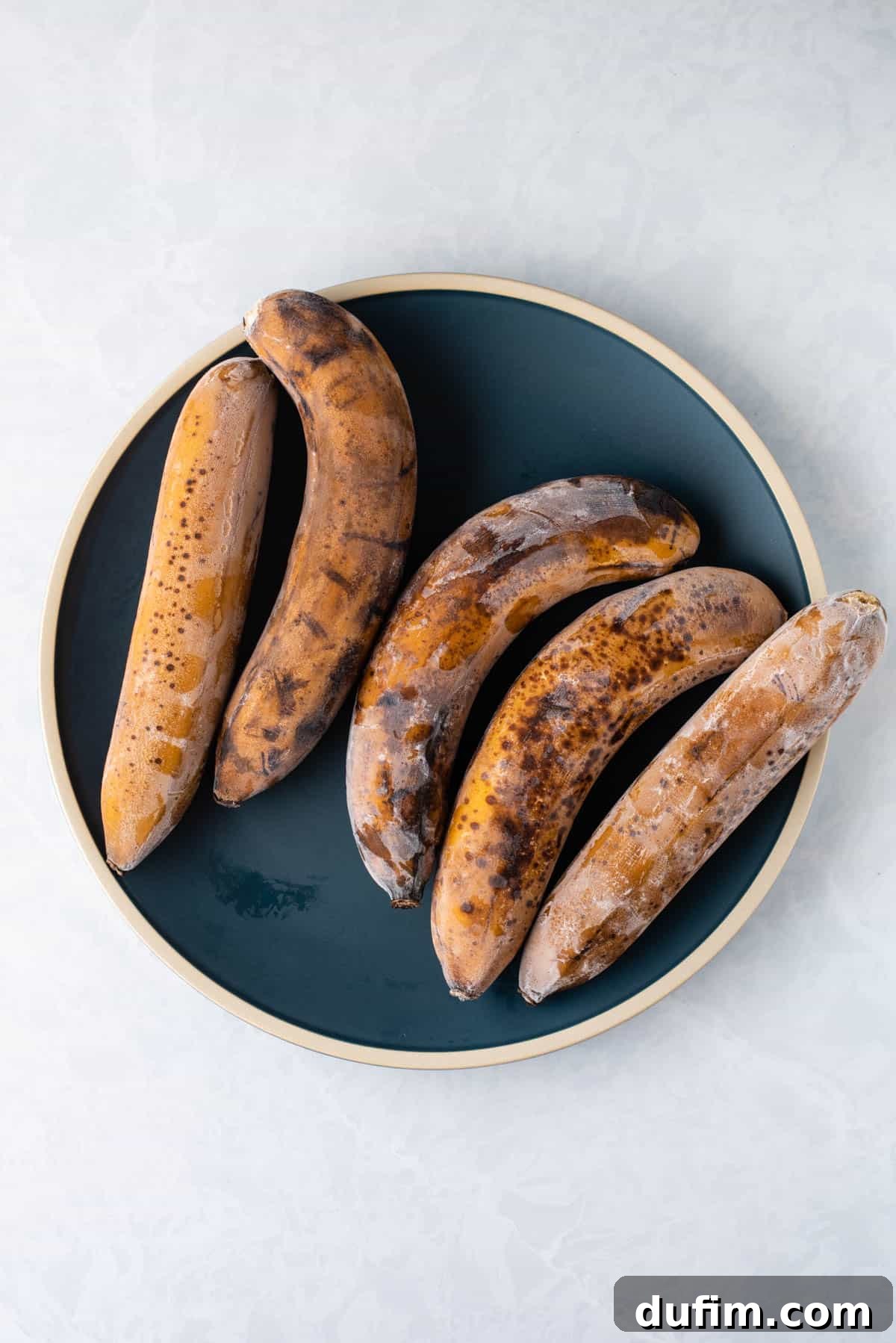 frozen bananas on a blue plate