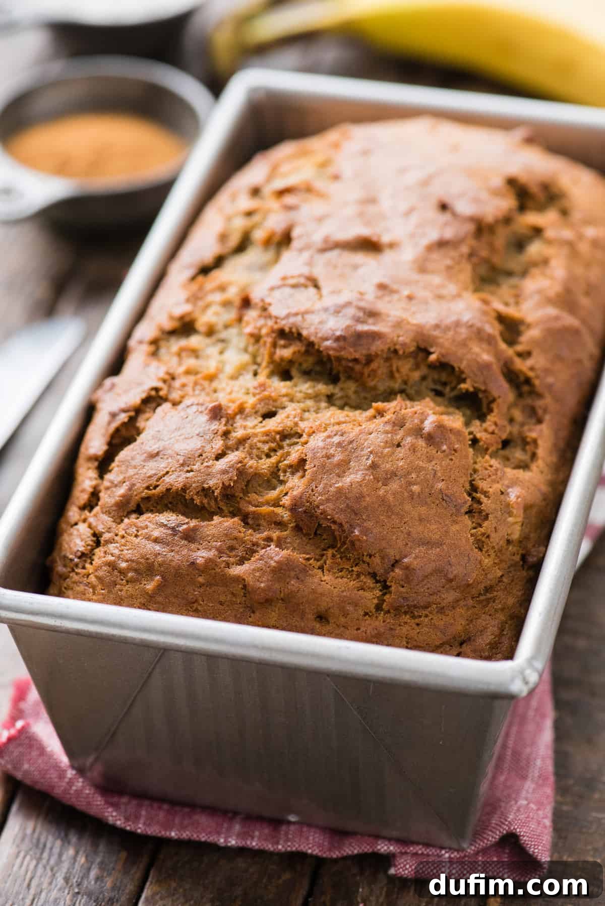 whole loaf of banana bread in metal loaf pan