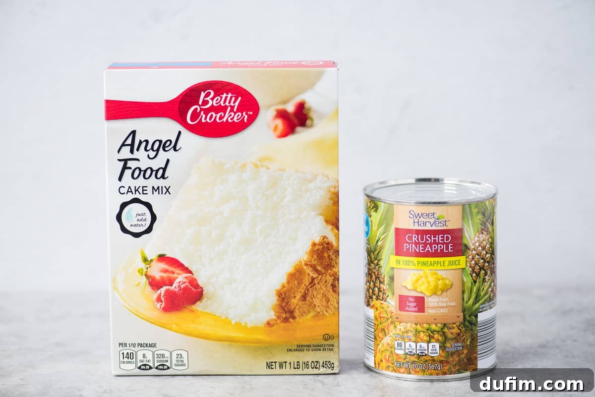 An angel food cake mix box and a can of crushed pineapple, the two core ingredients for this easy recipe, displayed on a clean white background.