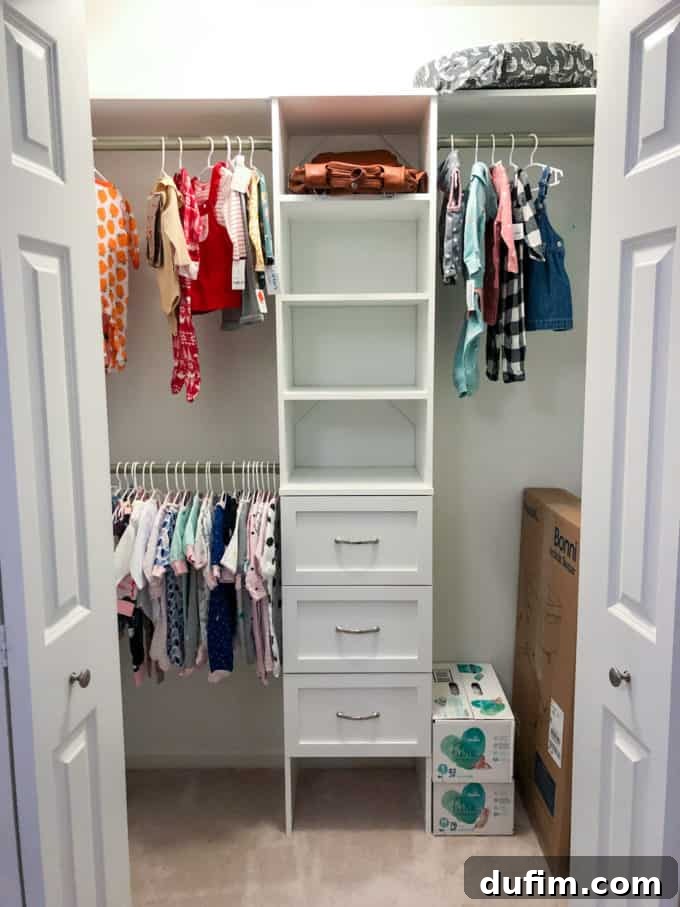 A curated display of baby clothes, organized and ready in the nursery closet.