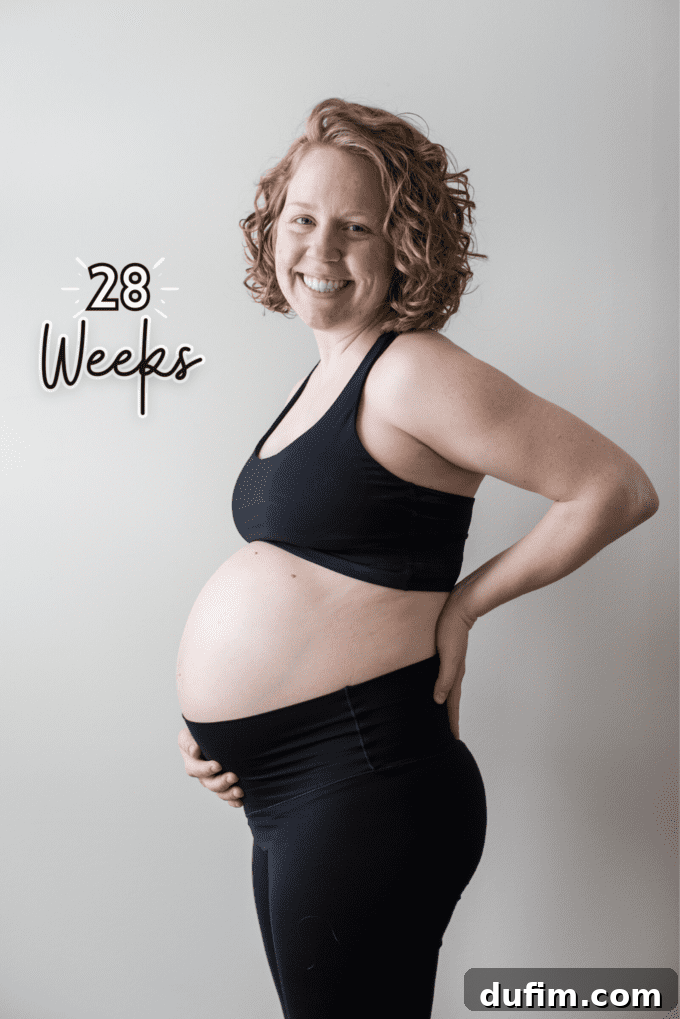 Another lovely image of the pregnant couple, showcasing their joy.