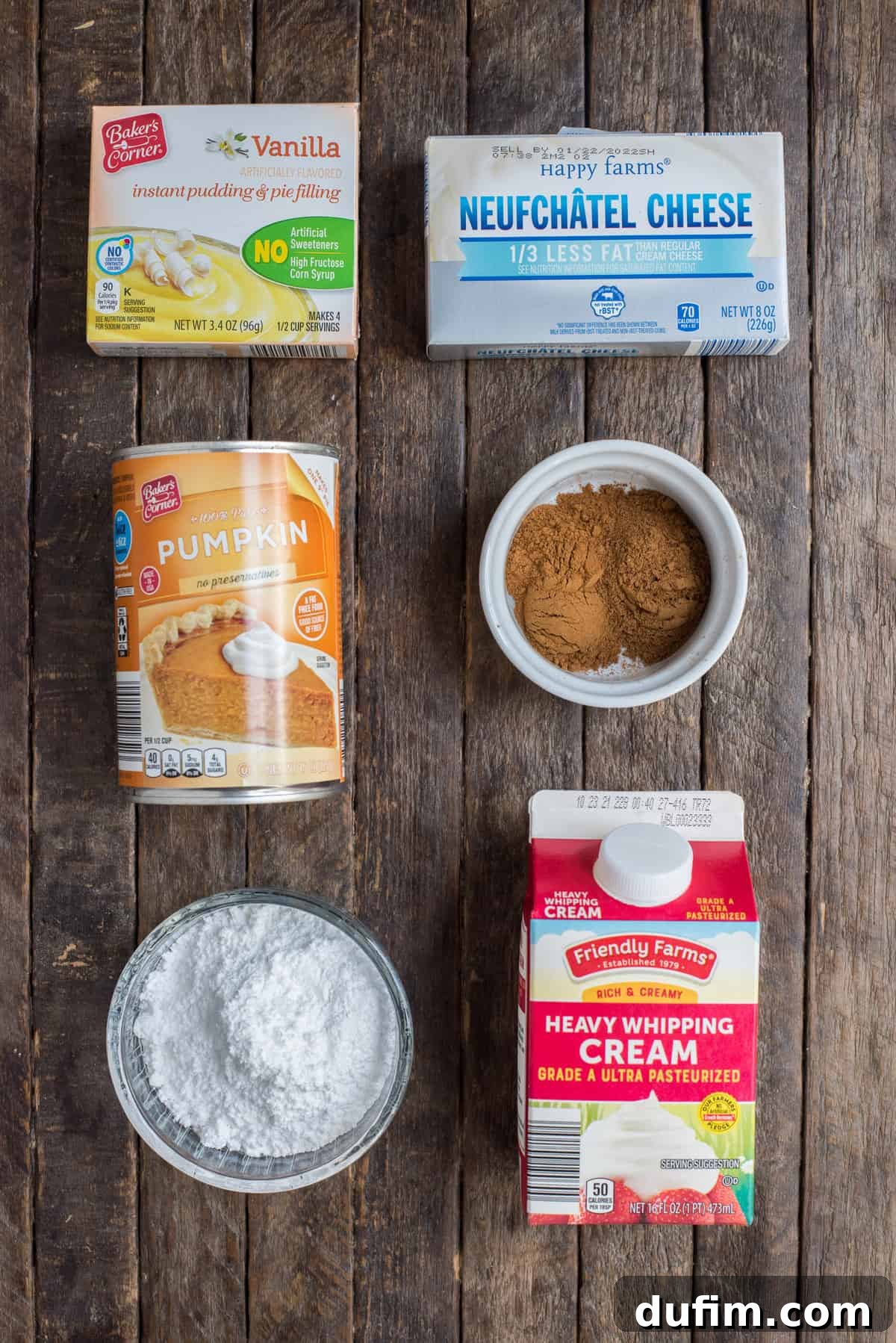 A beautiful flat lay photograph showcasing all the fresh, high-quality ingredients needed to create the perfect pumpkin fluff dip, neatly arranged on a rustic wooden background.