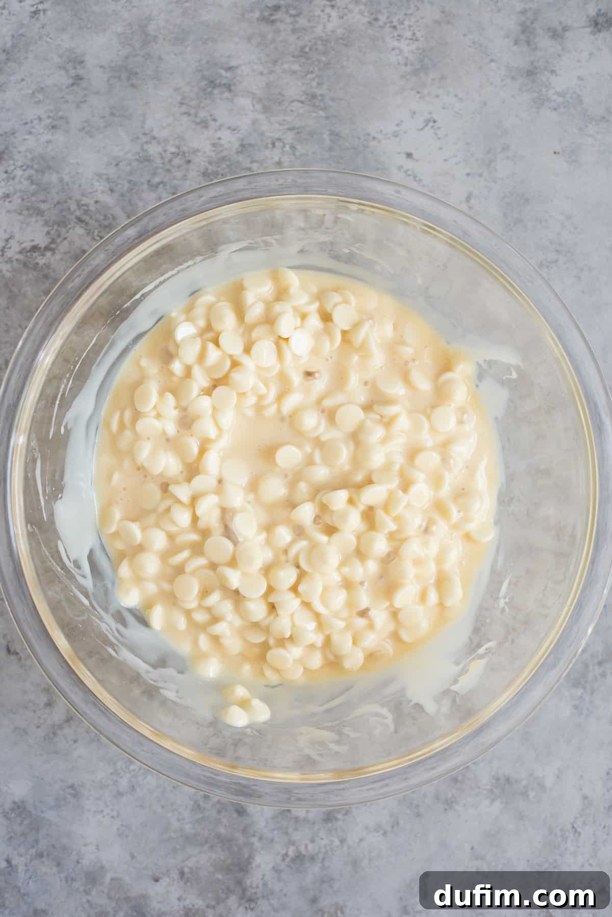 Decadent Oreo Fudge 3 Glass bowl filled with premium white chocolate chips and luscious sweetened condensed milk, ready for the microwave