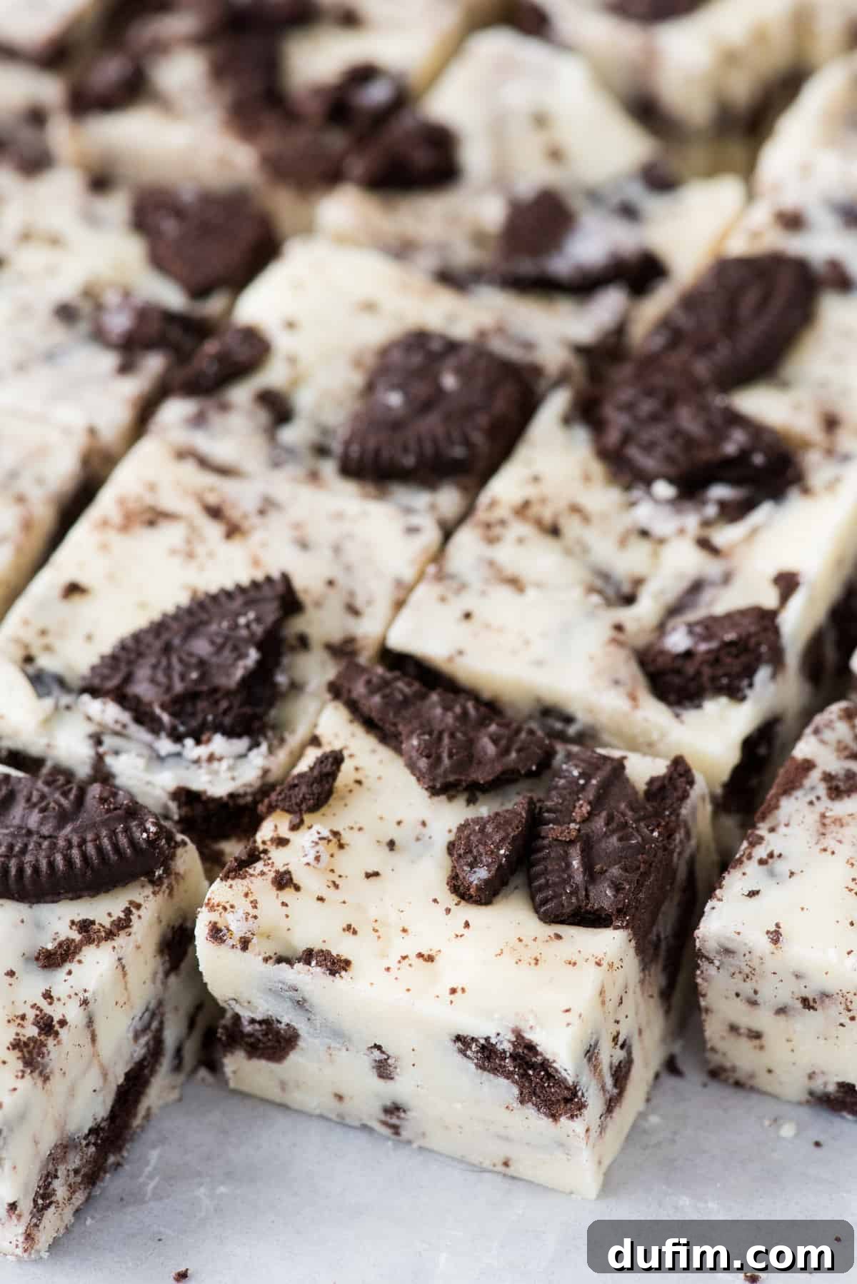 Decadent Oreo Fudge 7 Freshly cut Oreo fudge squares, perfectly showcasing the uniform size and delicious cookie pieces embedded within