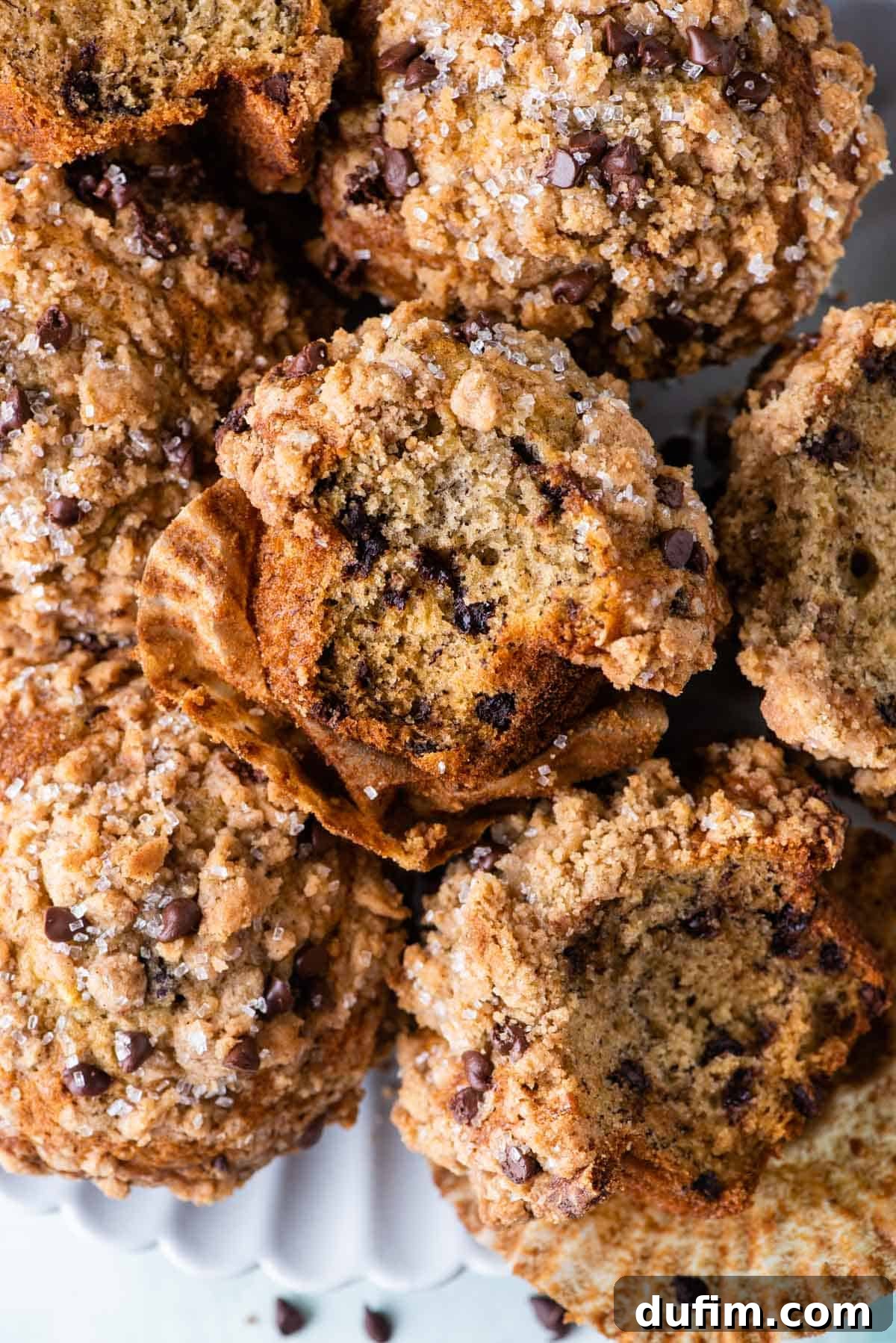 A close-up shot of a perfectly baked muffin or cake slice, showcasing the appealing texture and golden hue of the streusel topping.