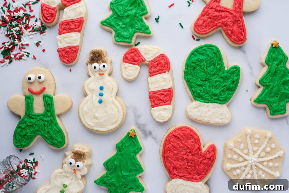An inviting overhead view of gluten-free sugar cookies festively decorated for Christmas, featuring gingerbread men, snowflakes, and tree shapes adorned with vibrant royal icing and sprinkles.