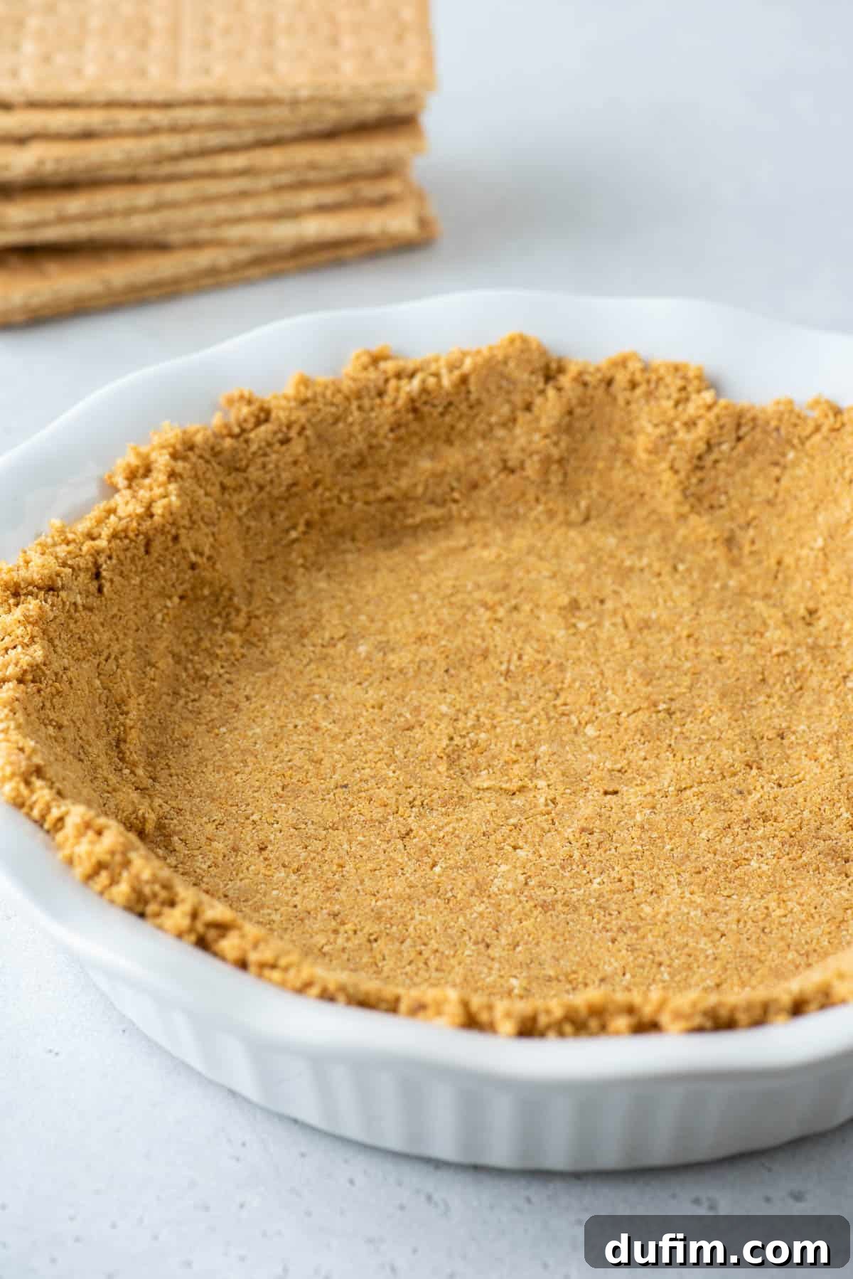 graham cracker crust in white pie plate 
