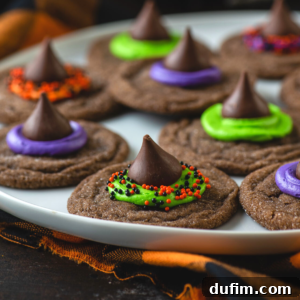 A white plate of witch hat cookies, ready for a Halloween celebration.