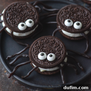 Creepy Cookie Crawlers 2 Three Oreo spiders on a black plate, ready to be served.